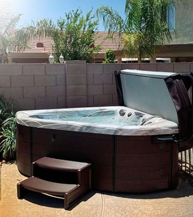 Lush plants and a wall create a private space to relax